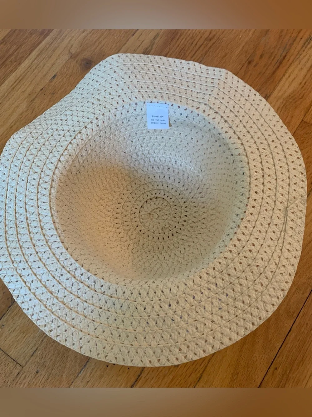 Tan straw hat with blue/white striped ribbon